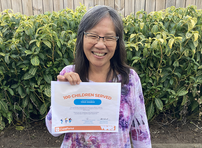 Woman Holding a Certificate